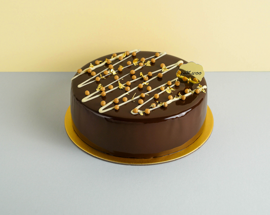 A moist and creamy coffee-flavoured layered cake infused with Baileys Irish Cream, topped with hazelnuts and chocolate glaze. The layers of coffee mousse, sponge, ganache and creme brulee, are also filled with nutty hazelnuts, making it the perfect choice for adults and events.